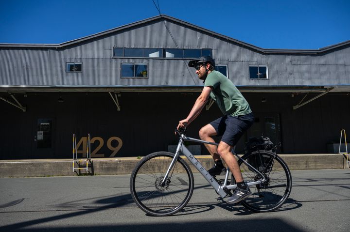 Man riding an e-bike on a path.