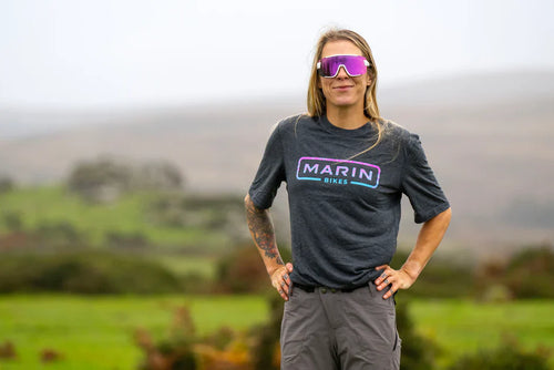 Blonde woman wearing Marin bikes T-shirt outside