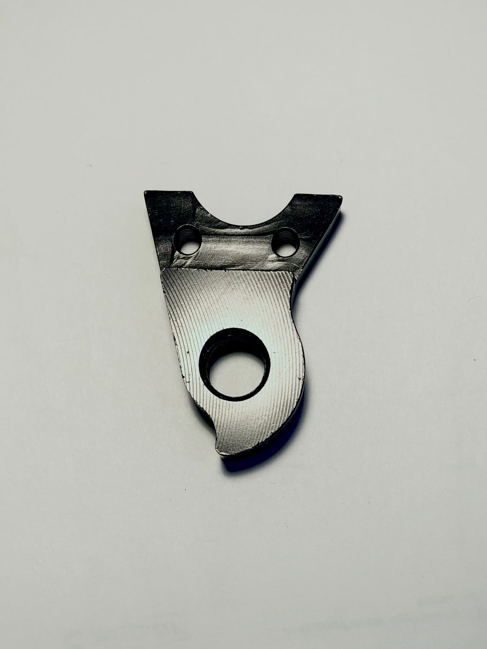 A black Marin Bikes rear derailleur hanger