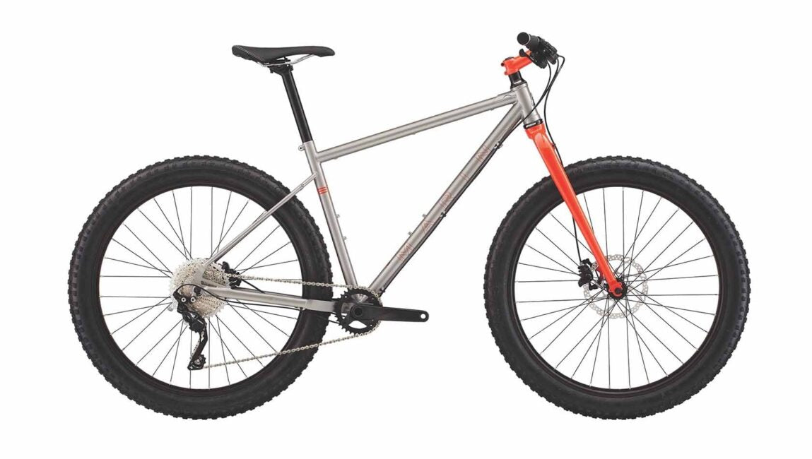An image of a Marin Bikes rigid mountain bike painted in silver with an orange fork