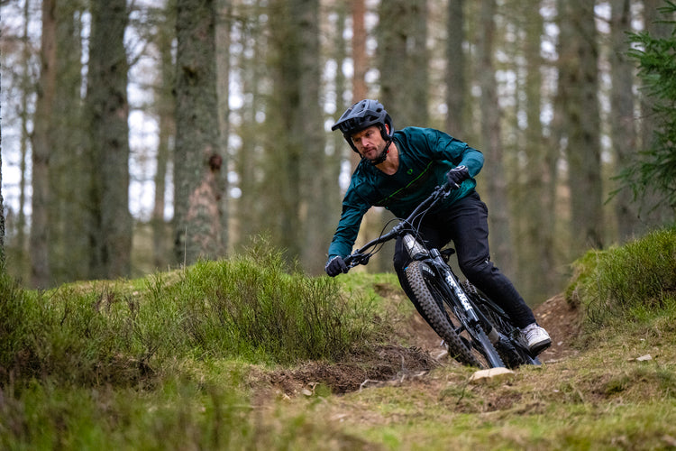 Man riding a woodland trail on an ebike