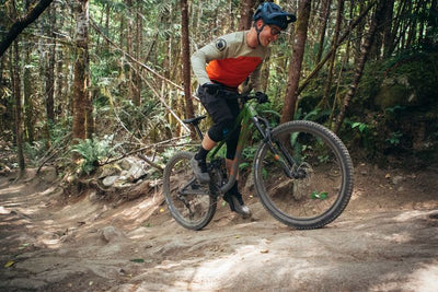 Man rides a bike uphill off road