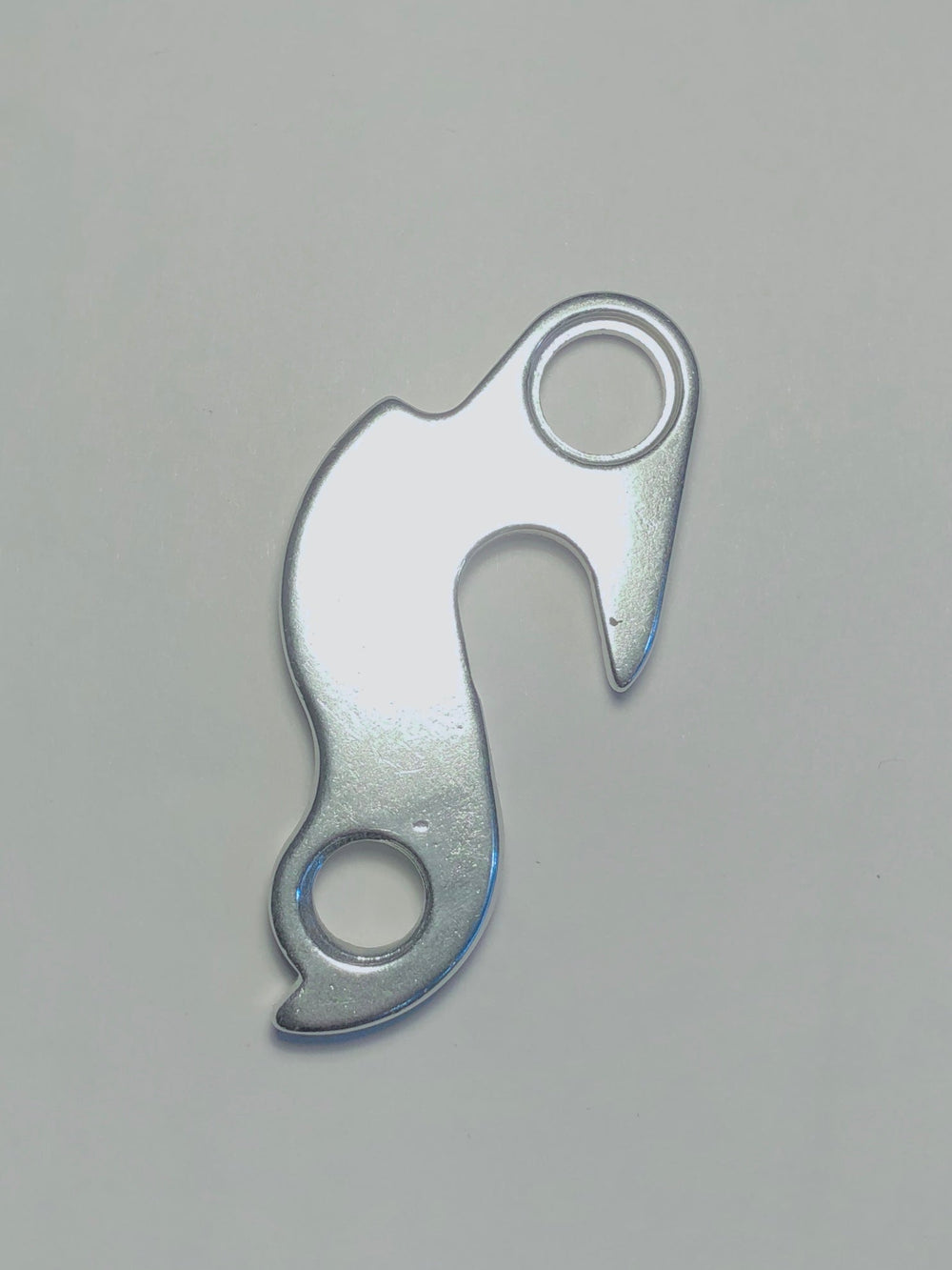 A silver Marin Bikes rear derailleur hanger
