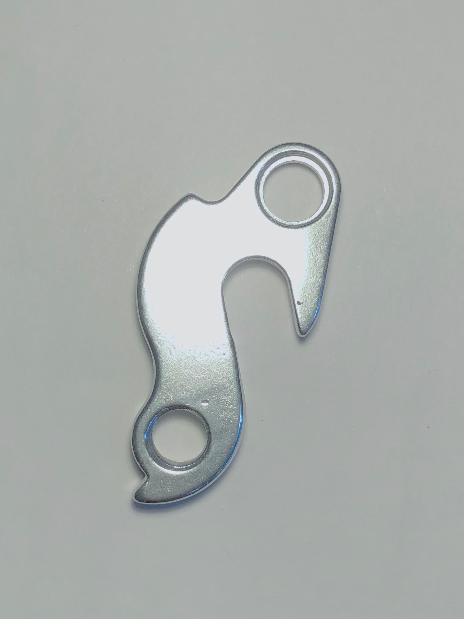 A silver Marin Bikes rear derailleur hanger