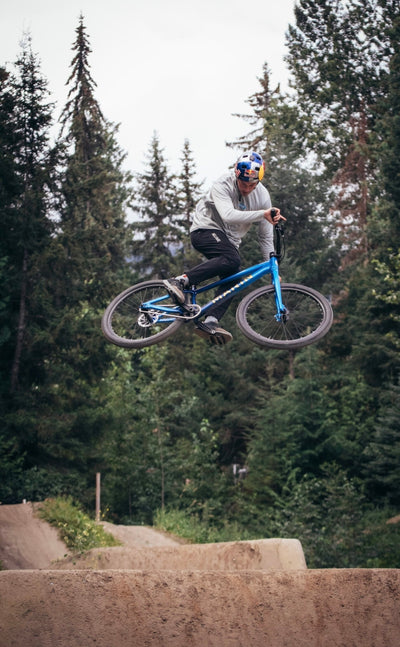 An image of Marin Bikes sponsored rider Matt Jones riding a Marin Alcatraz dirt jump bike on some dirt jumps