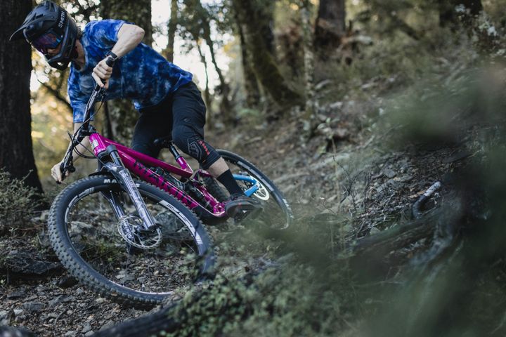 Man rides a rough woodland trail