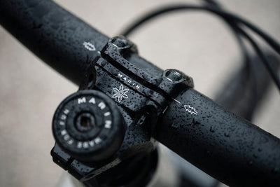 Close-up of a black bicycle handlebar with 'Marin' branding.