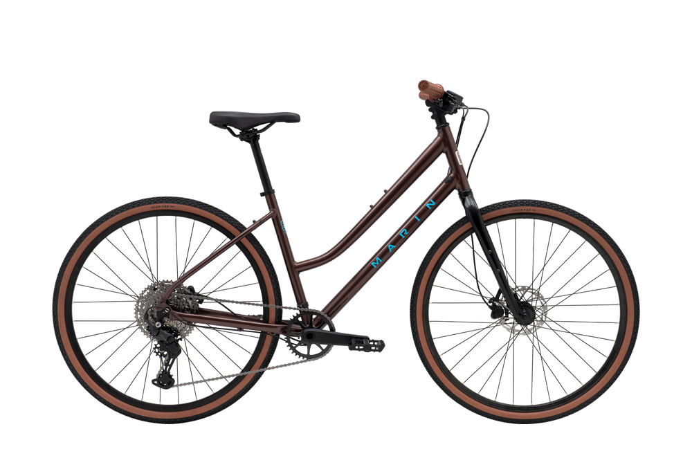 Brown bicycle with 'Mazda' branding on a white background