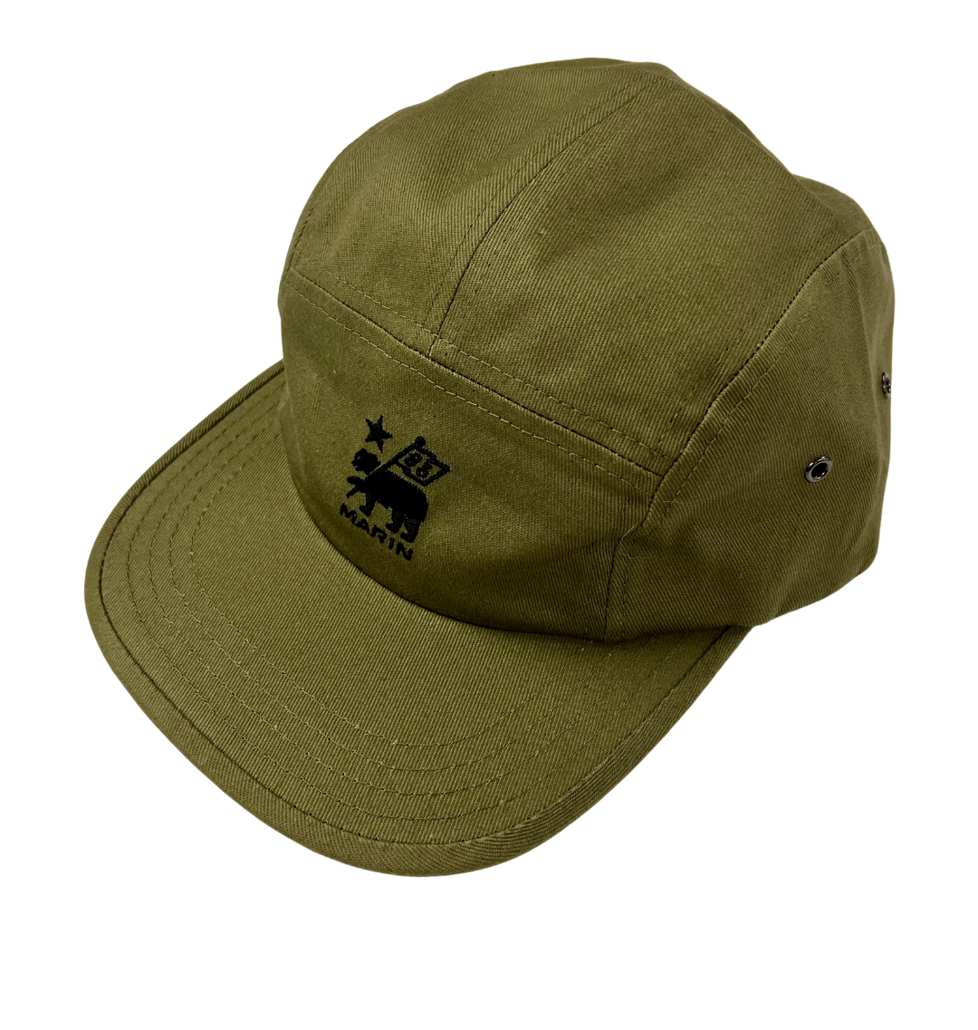 Green cap with a logo on a white background