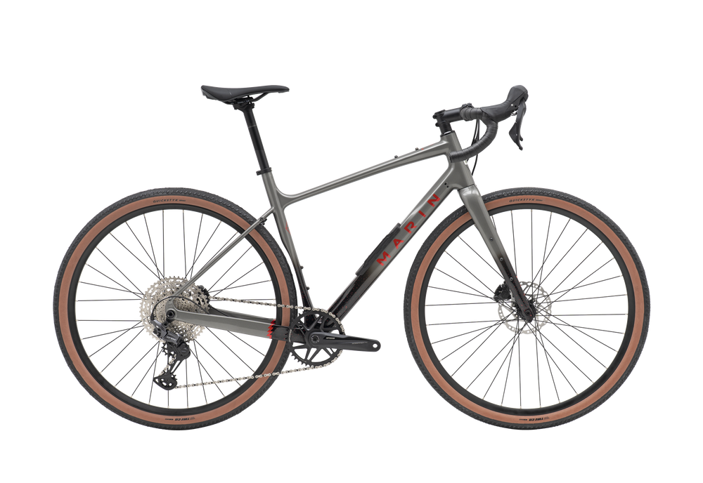 Gray bicycle with brown tires on a white background