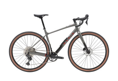 Gray bicycle with brown tires on a white background