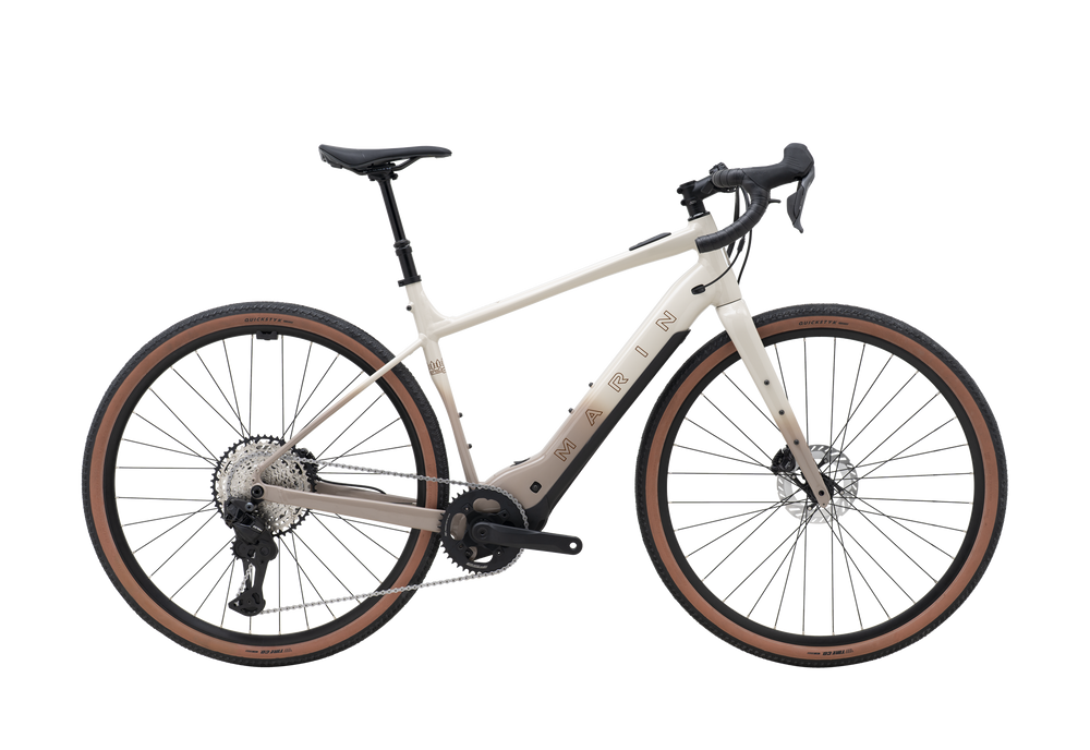 White electric bicycle with brown tires on a white background