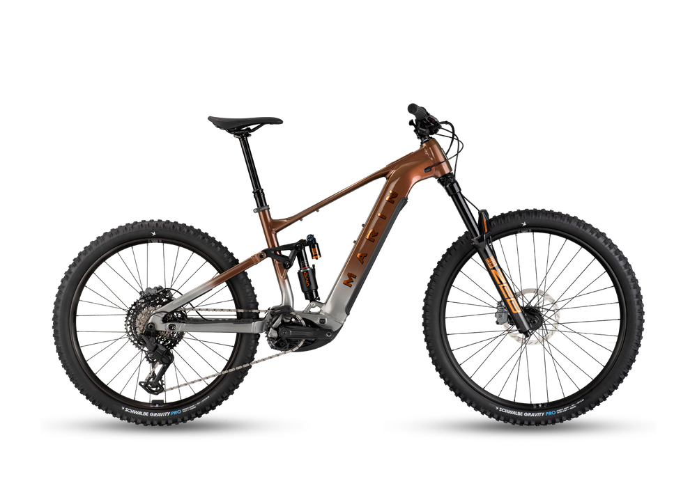 Mountain bike with a brown frame and black tires on a white background