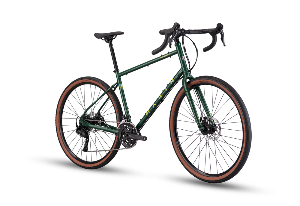 Green bicycle with brown tires on a white background