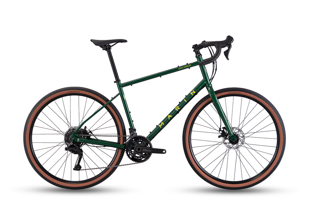 Green bicycle with brown tires on a white background