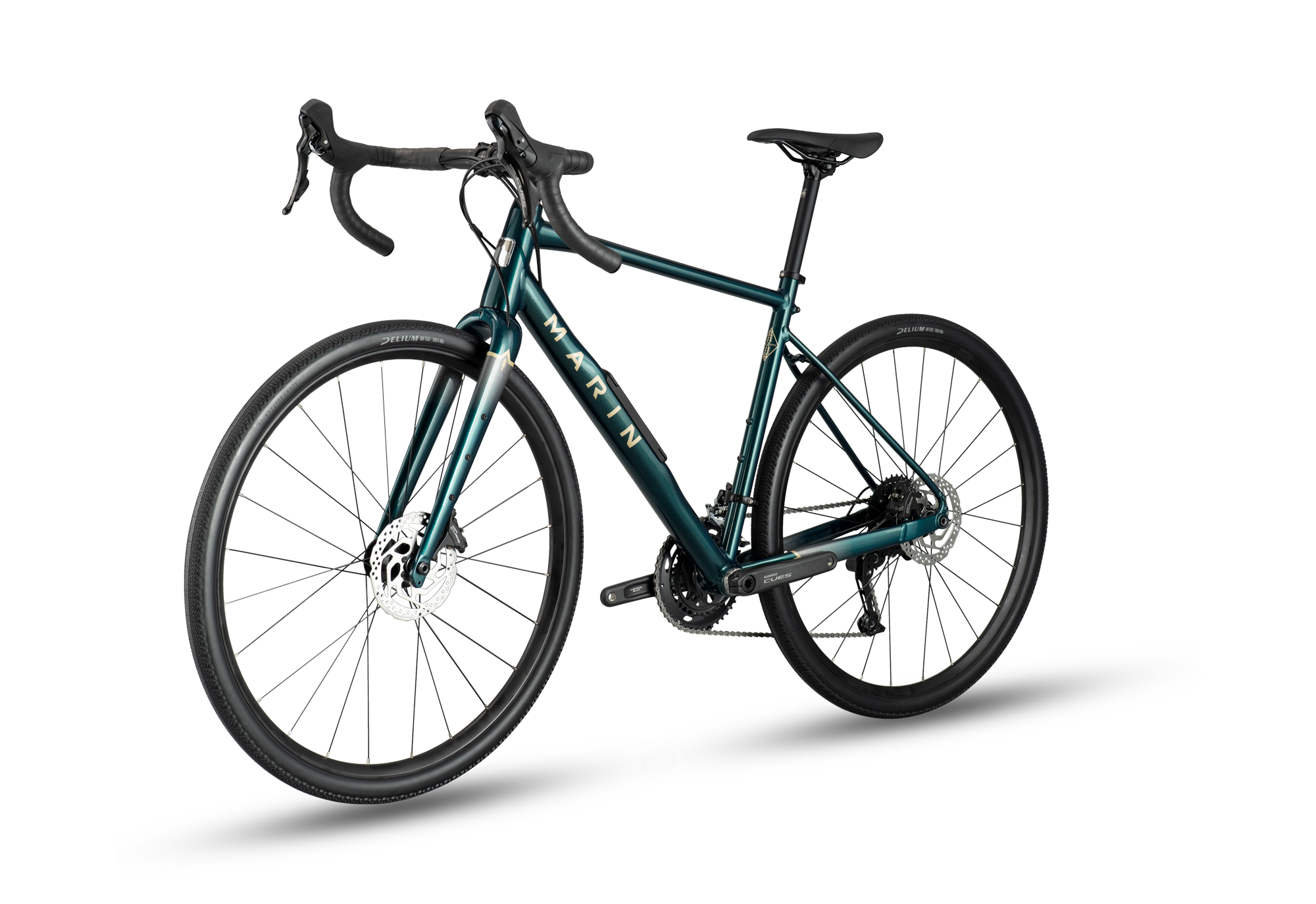 A dark teal mountain bike with black components, drop handlebars, and black wheels, shown from a three-quarters front angle on a white background with a soft shadow.