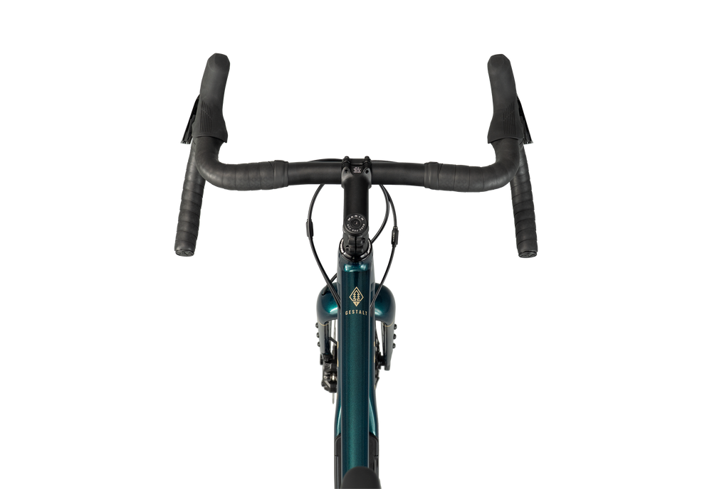 Front view of a drop-bar bicycle with black handlebars and grips, a dark teal frame, and a visible diamond logo on the head tube, isolated on a white background.
