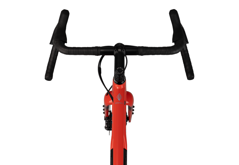 Red bicycle frame with black handlebars on a white background