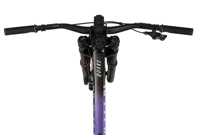 Close-up of a bicycle handlebar with 'Quake' branding on a white background