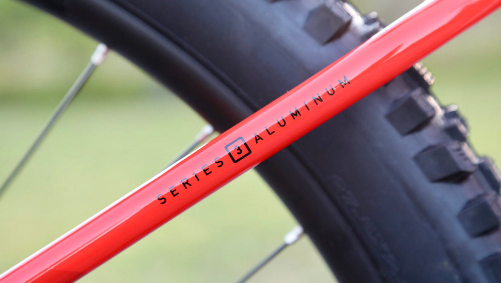 A close-up image of a Marin Bikes bicycle with the words 'Series 3 Aluuminum' painted on the frame