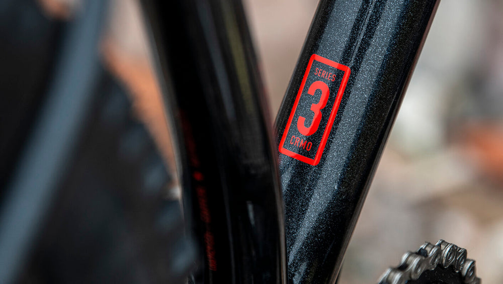 A close-up image of a Marin Bikes bicycle with the words 'Series 3 CRMO' painted on the frame