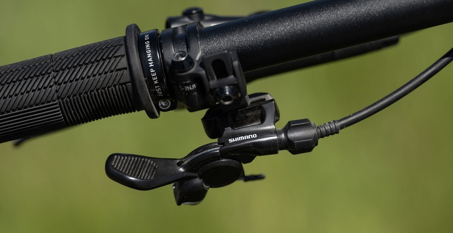 An image of a Marin Bikes mountain bike handlebar with a Shimano dropper post remote lever