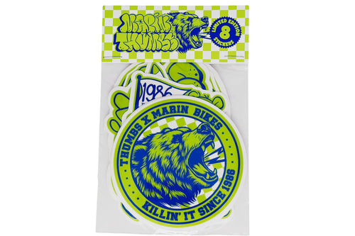 A package of Thomas & Marin Bikes stickers featuring a blue and lime green roaring bear design with the text 'KILLIN' IT SINCE 1986' and a checkered header card.