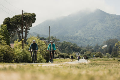 Couple ride along a rural road