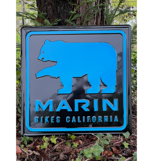 blue bear graphic on black sign