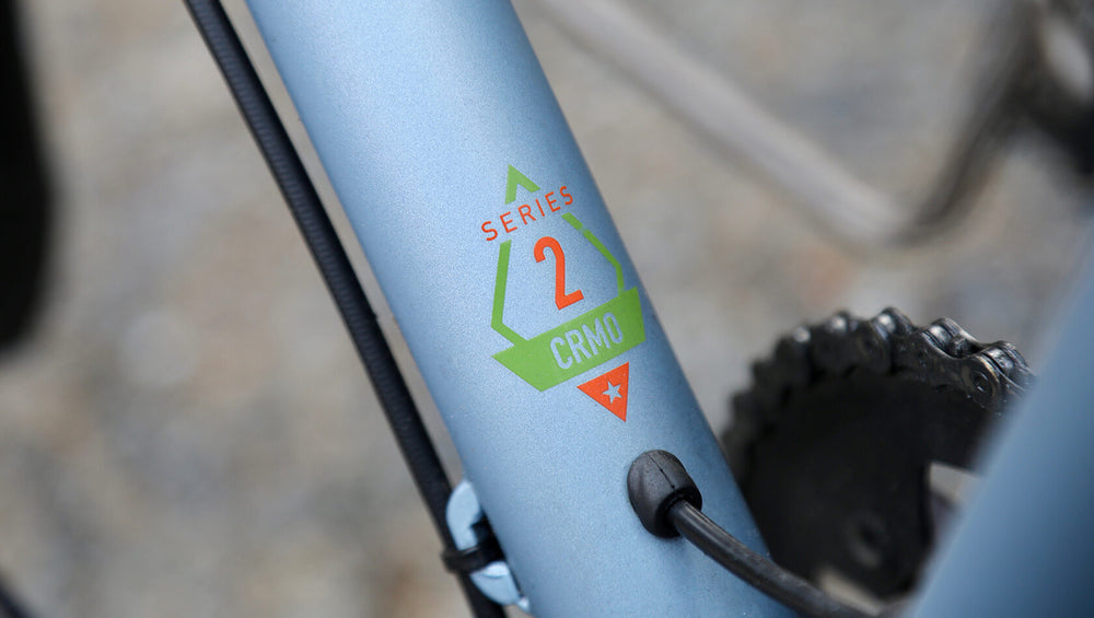 A close-up image of a Marin Bikes bicycle with the words 'Series 2 CRMO' painted on the frame