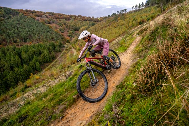 Girl rides a Rift Zone E downhill