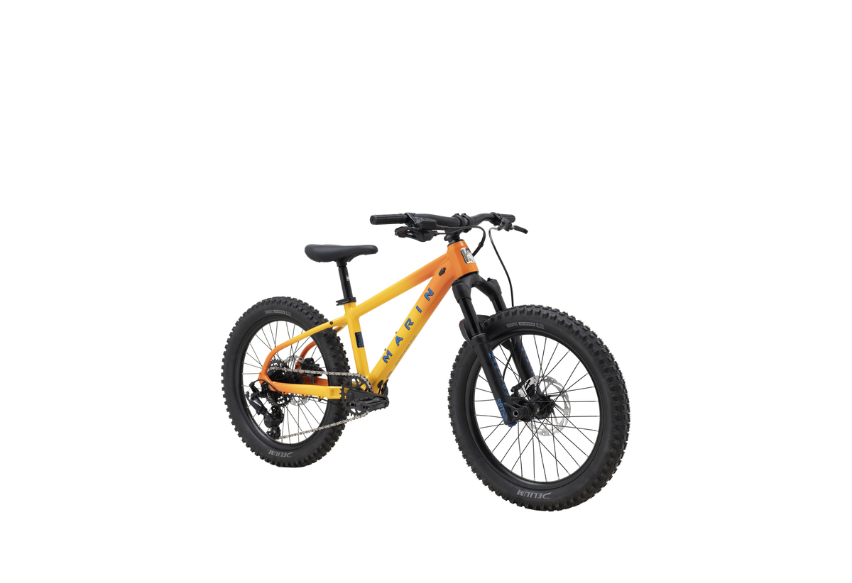 A yellow and orange Klatr full-suspension fat tire mountain bike with black components, shown from a three-quarters angle on a solid white background.