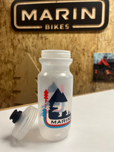 Marin Bikes water bottle with logo on a wooden surface