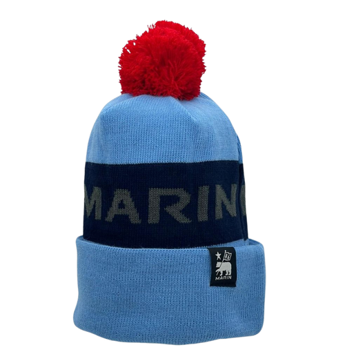 A blue and black Marin Bikes bobble hat, with a red bobble