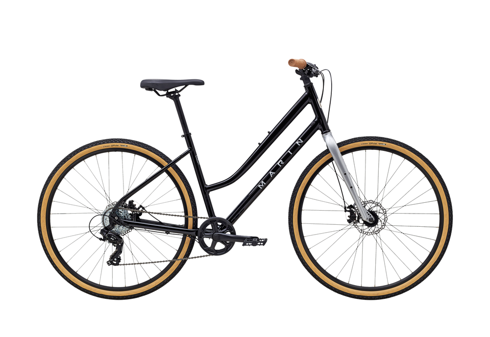 Black bicycle with gold rims on a white background