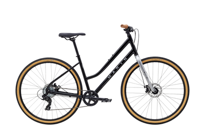 Black bicycle with gold rims on a white background