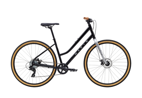 Black bicycle with gold rims on a white background
